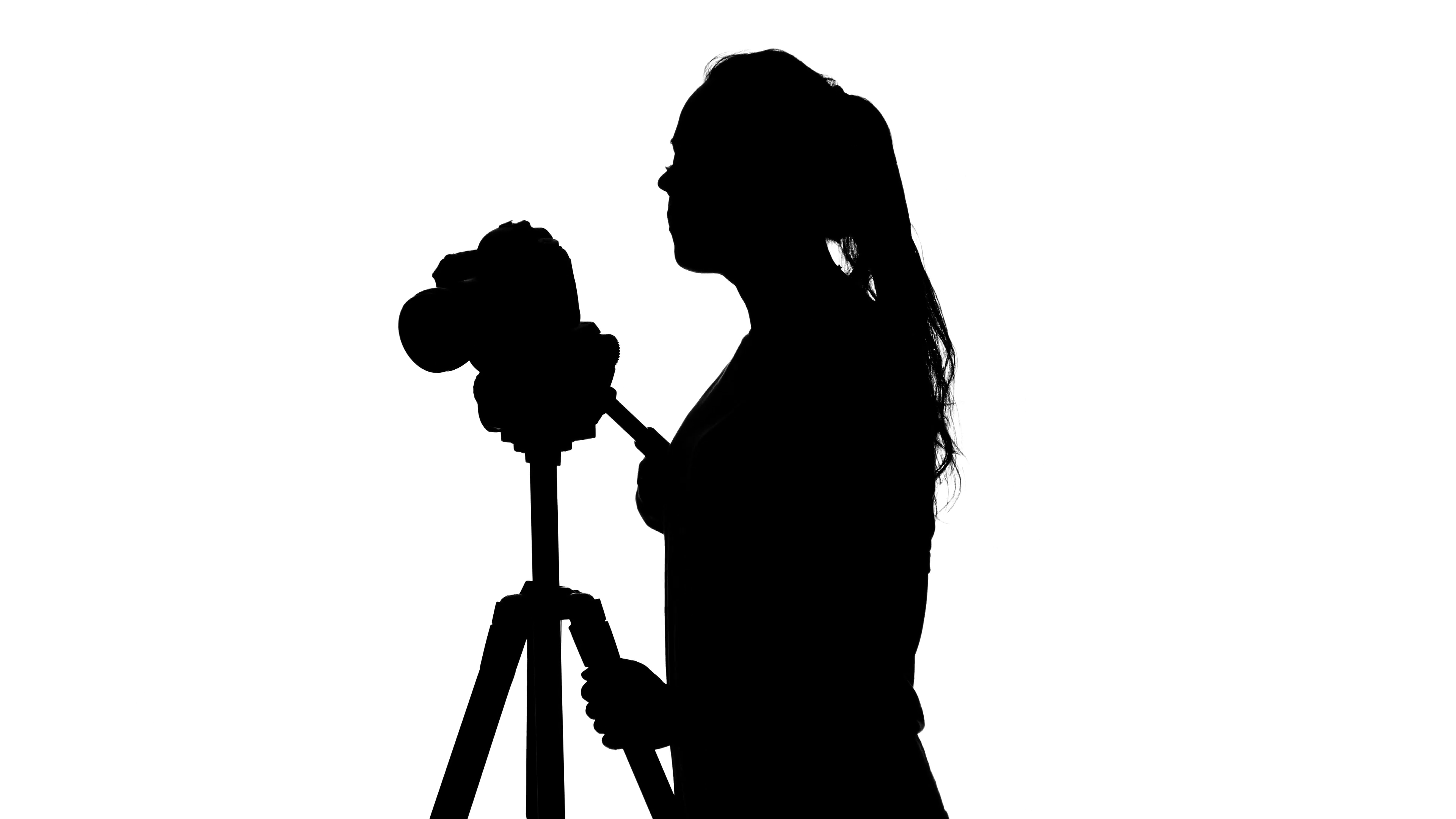 3840x2160 Operator Adjusts The Tripod Leg. Photography In Studio. White