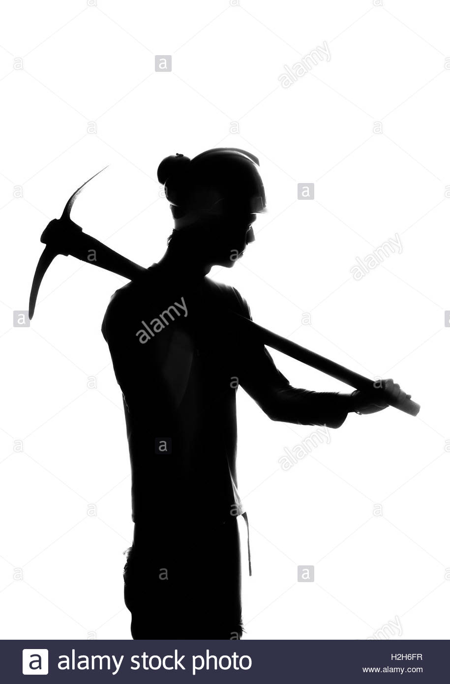 915x1390 Silhouette Of A Mine Worker With A Pick Stock Photo, Royalty Free