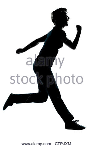 300x470 Silhouette Of Happy Teenager Boy Running On The Shore Stock Photo