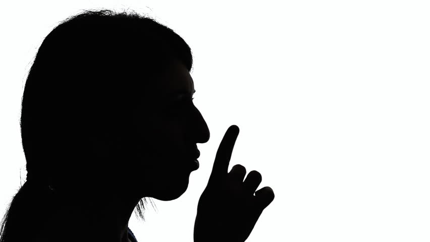 852x480 A Woman Making A Gesture With Her Finger Over Her Mouth To Shut Up