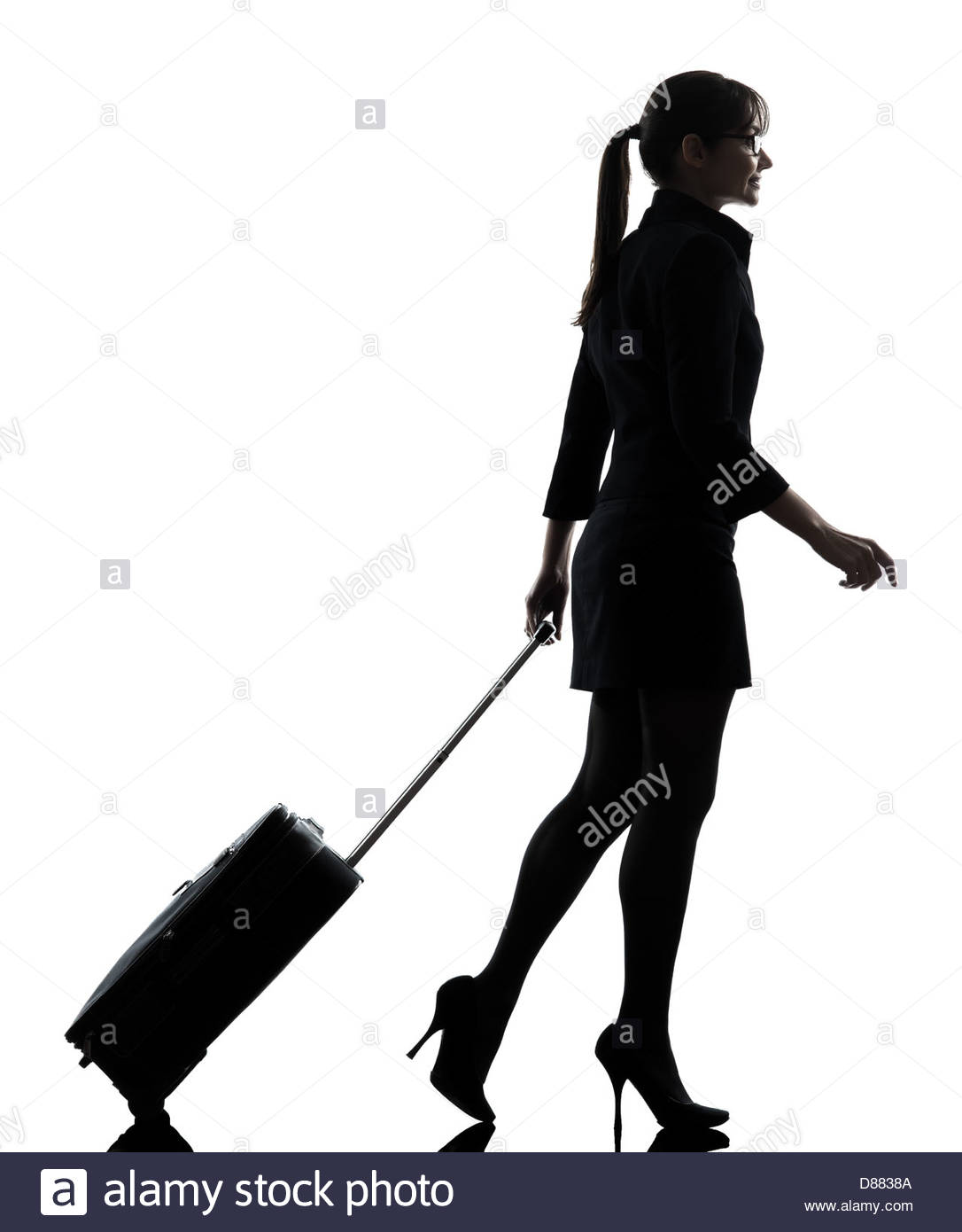 1086x1390 One Business Woman Traveler Walking Suitcase Silhouette Studio