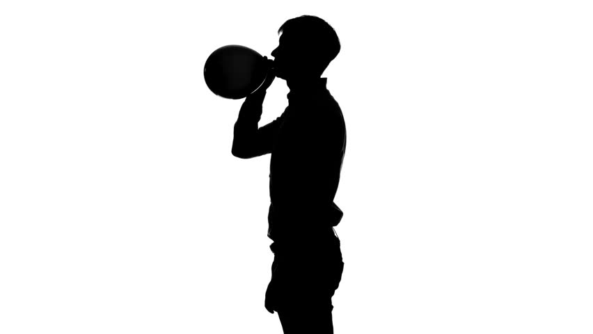 852x480 Man Is Inflating An Air Balloon And Ties It. Silhouette. White