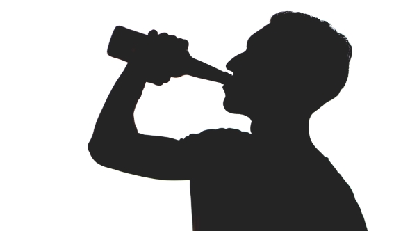 590x332 Silhouette Of A Young Man Drinking Beer From A Bottle Isolated