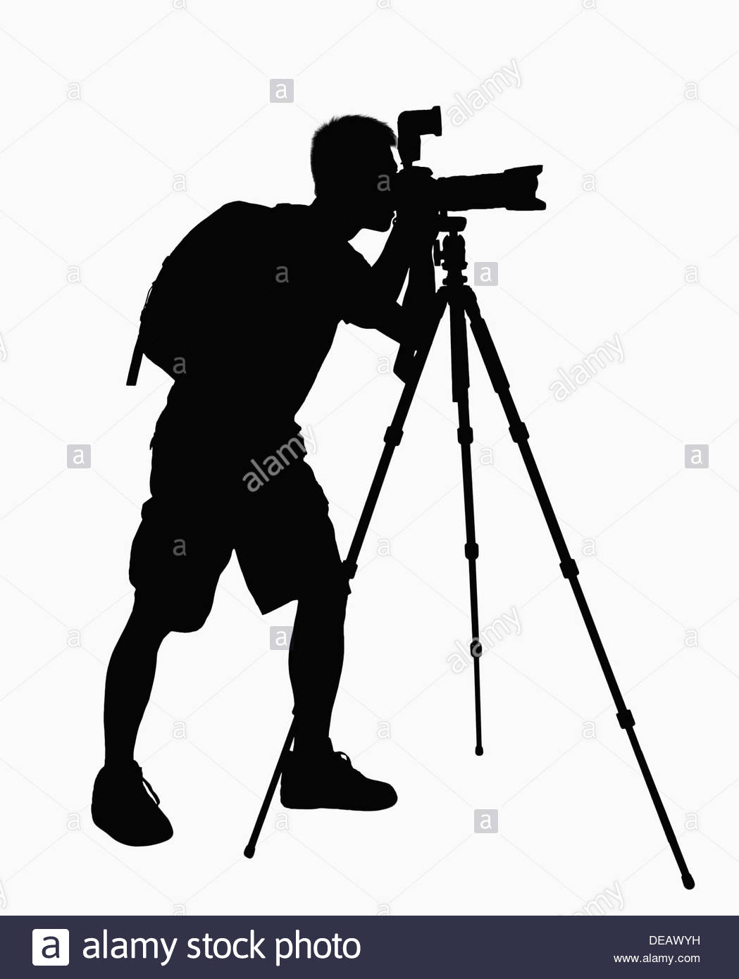 1049x1390 Silhouette Of Man Taking Pictures With Camera On Tripod Stock