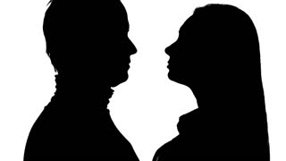 320x180 Silhouette Of Couple Sitting On The Beach And Kissing