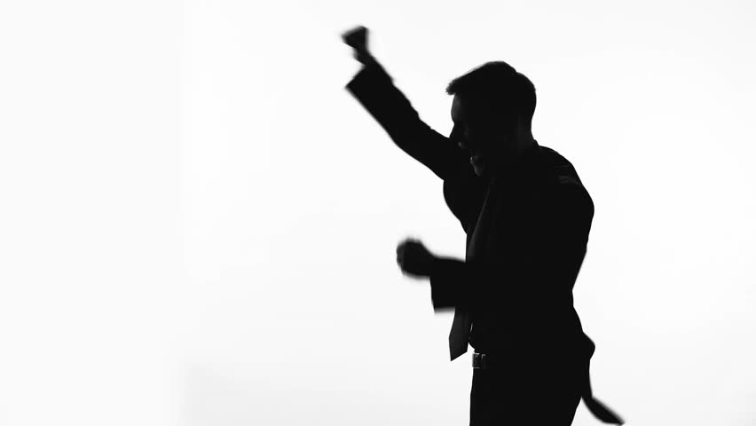 852x480 Businessman Silhouette Raises Fist Up, Celebrates Success, Proud