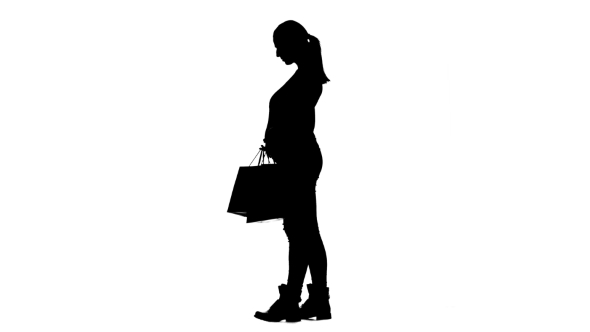 590x332 Pregnant Girl With Bags In Her Hands Was Shopping. Silhouette