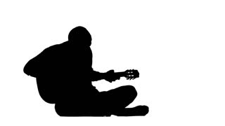320x180 Silhouette Guy Plays On A Guitar Sitting In A Field On A Haystack