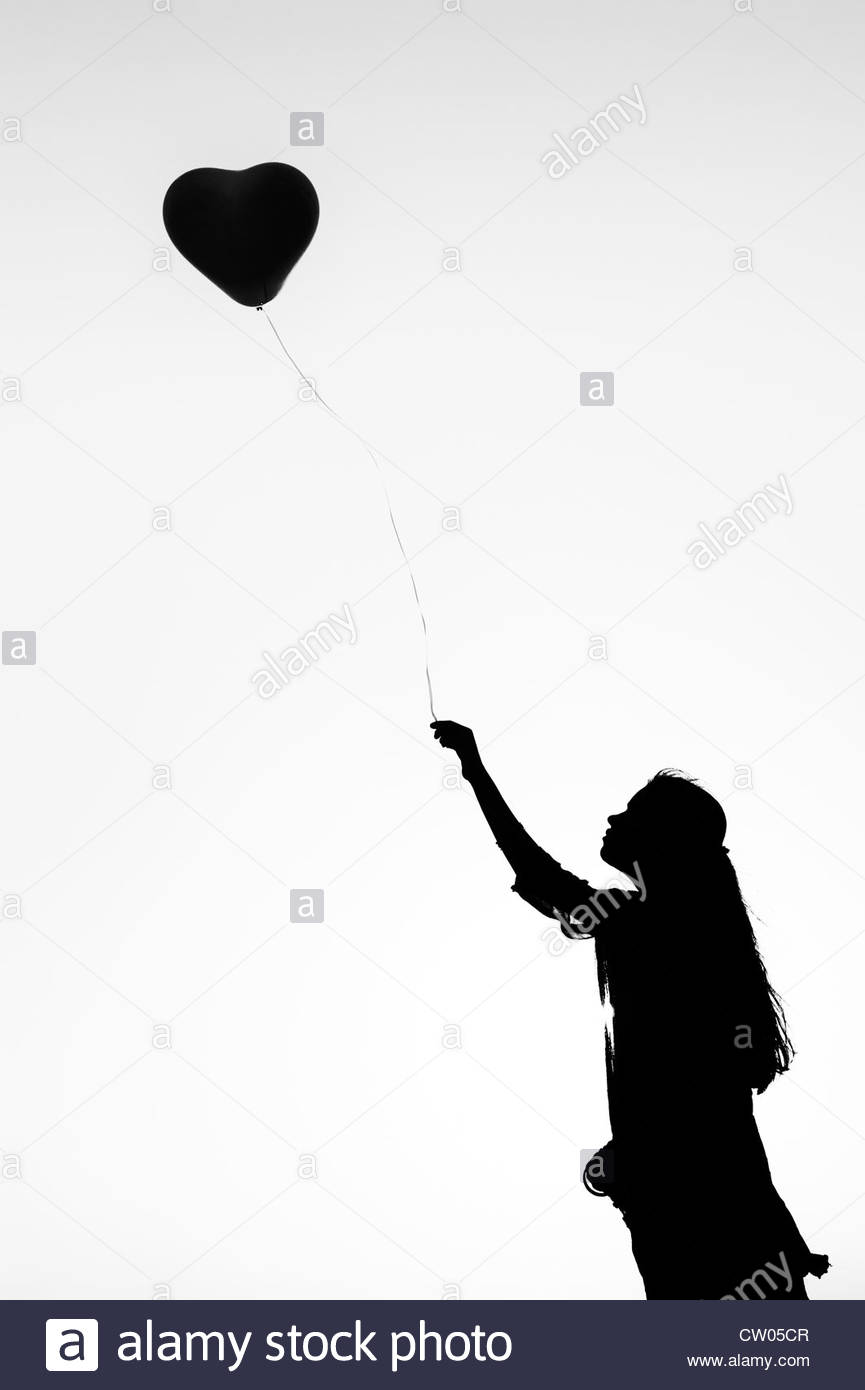 865x1390 Indian Teenage Girl Holding A Heart Shaped Balloon. Silhouette
