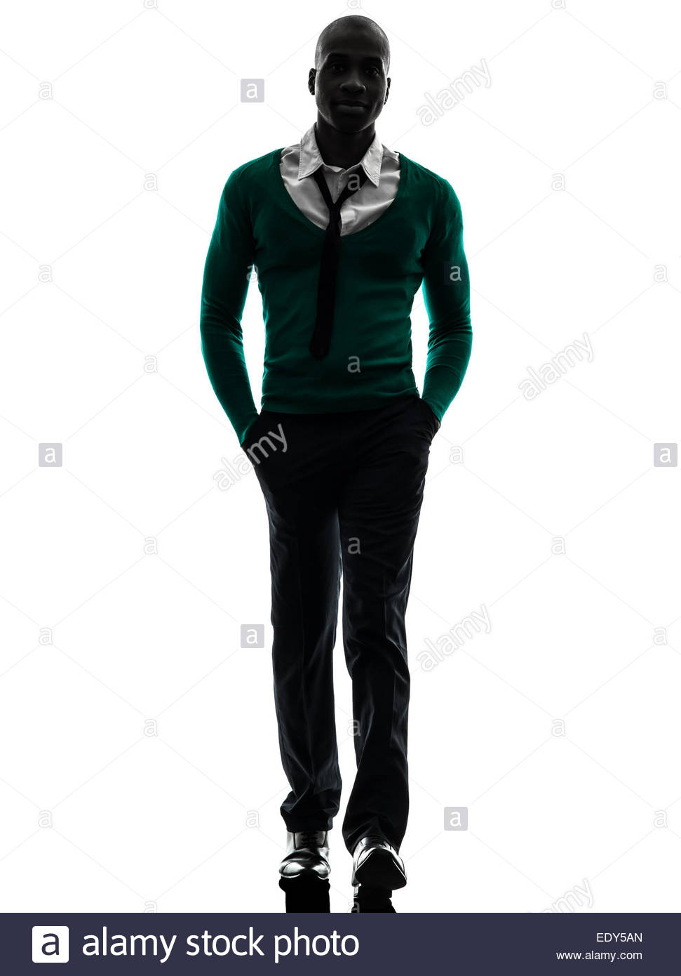 971x1390 One African Black Man Walking In Silhouette Studio On White Stock