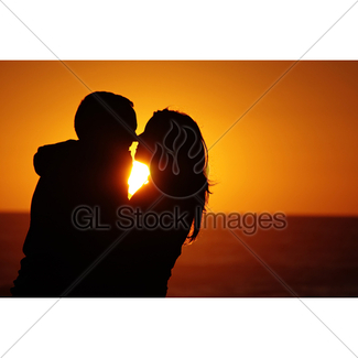 325x325 Couple Watching Sunset On The Beach Gl Stock Images