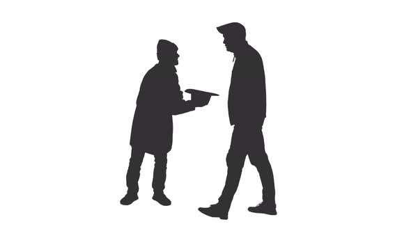 590x332 Silhouette Of A Beggar Gets A Coin From A Man Walking By By Mgpremier