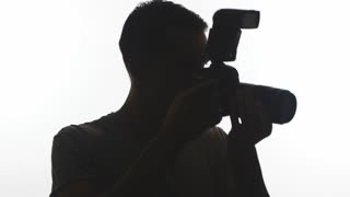 320x180 Man Taking Picture With Camera (Silhouette) Stock Video Footage