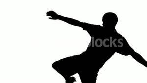 300x169 Silhouette Of Soccer Player Kicking Ball Stock Video Footage