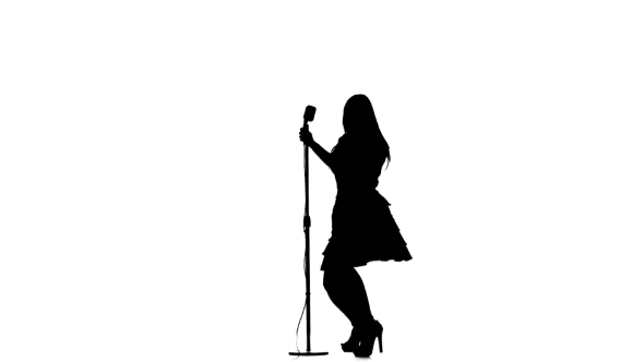 590x332 Silhouette Of Woman Singing A Song And Dancing Near A Retro