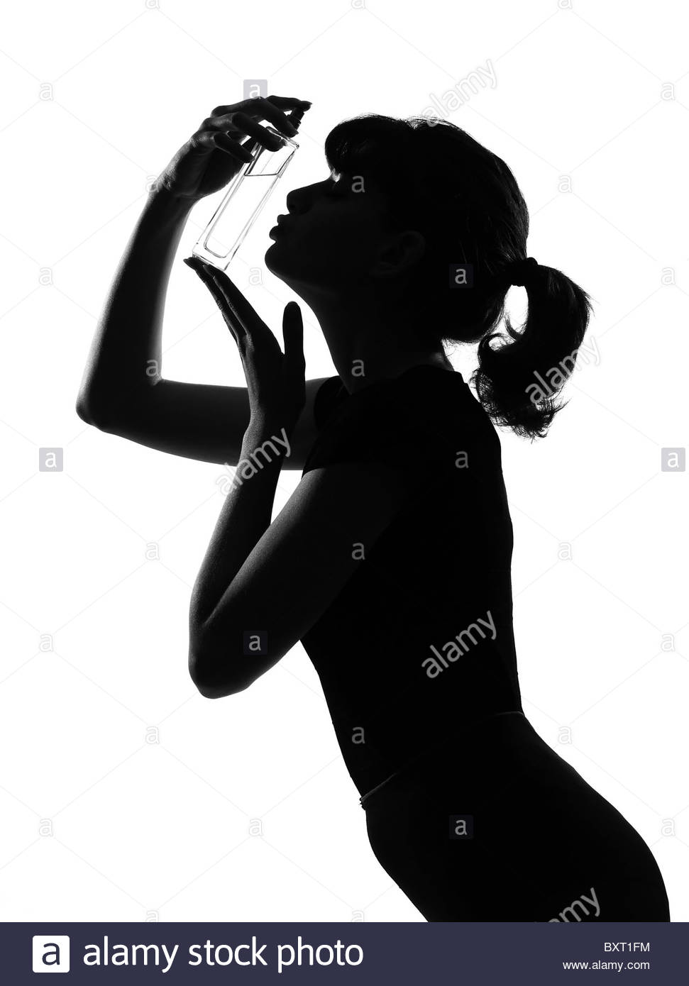 971x1390 Silhouette In Shadow Of A Young Woman Kissing Her Perfume Bottle