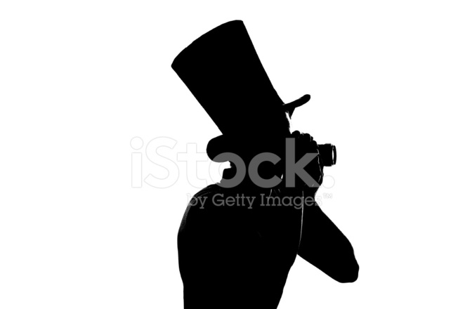 662x440 Silhouette Of A Young Photographer With Camera Stock Photos