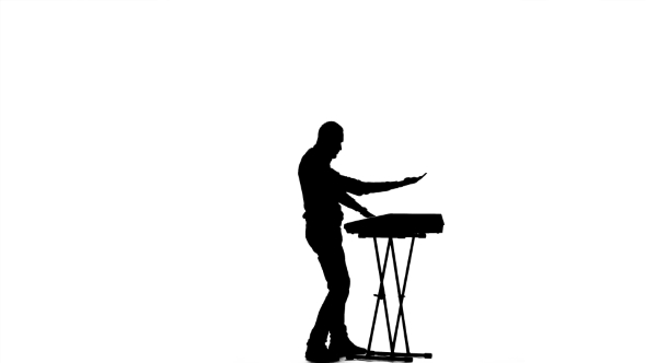 590x332 Man Playing Fast Music Synthesizer. Silhouette On A White