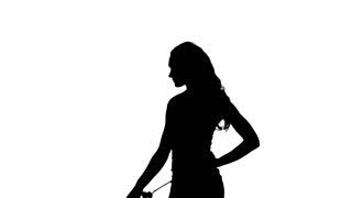 320x180 Silhouette Beautiful Woman Smelling A Flower Rose. Slow Motion