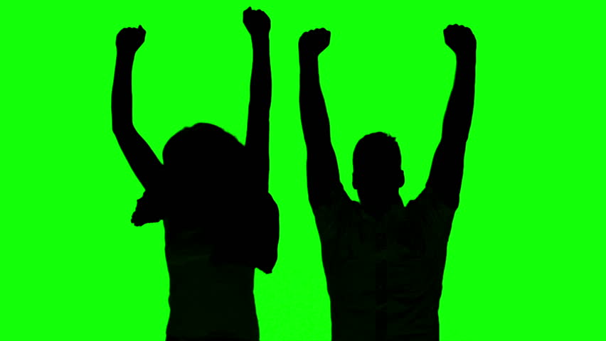 852x480 Silhouette Of Couple Jumping And Raising Arms On Green Screen
