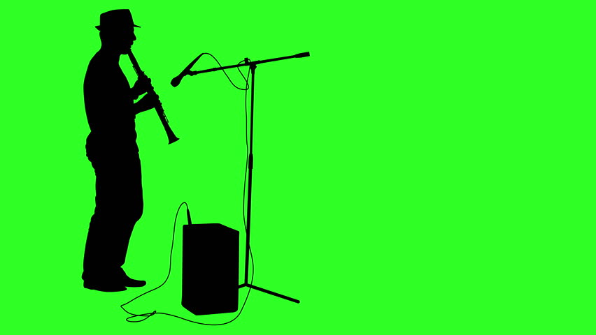 852x480 Silhouette Of A Man Who Makes A Stand With A Microphone On