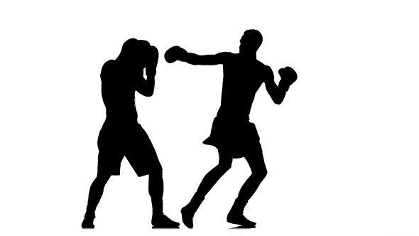 590x332 Training Punch With Turn Of The Body. Silhouette Of Boxers By