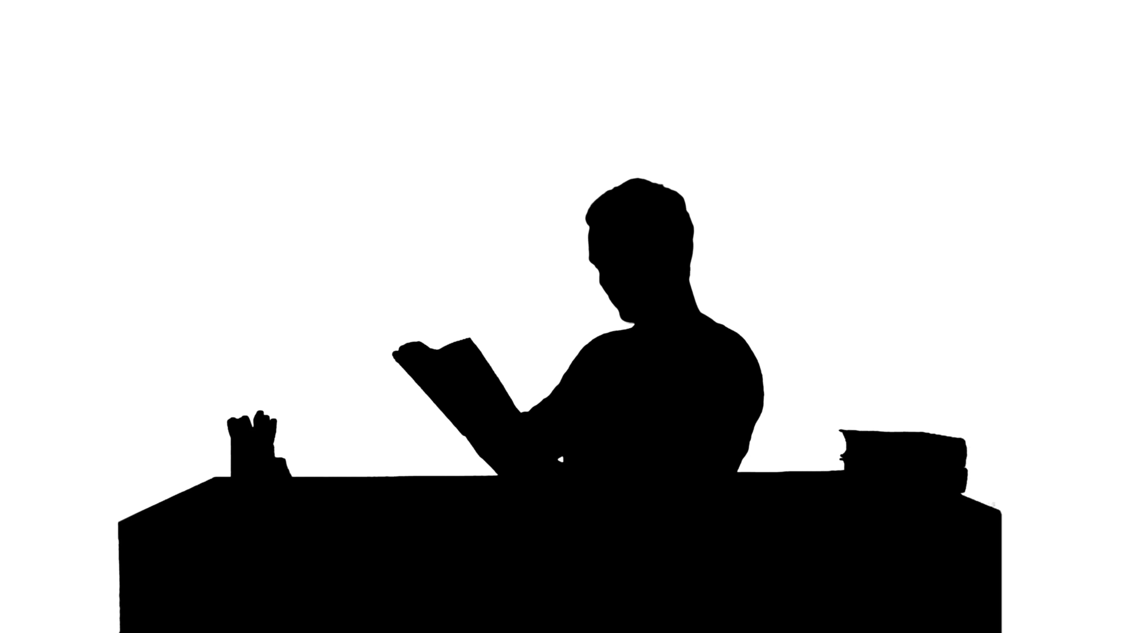 3840x2160 Silhouette Portrait Of A Male Student Reading A Book Stock Video
