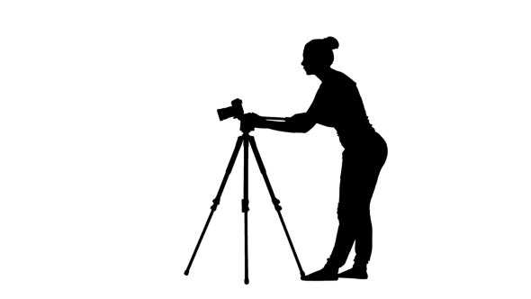 590x332 Operator Works With The Camera On A Tripod. Silhouette. By Kinomaster