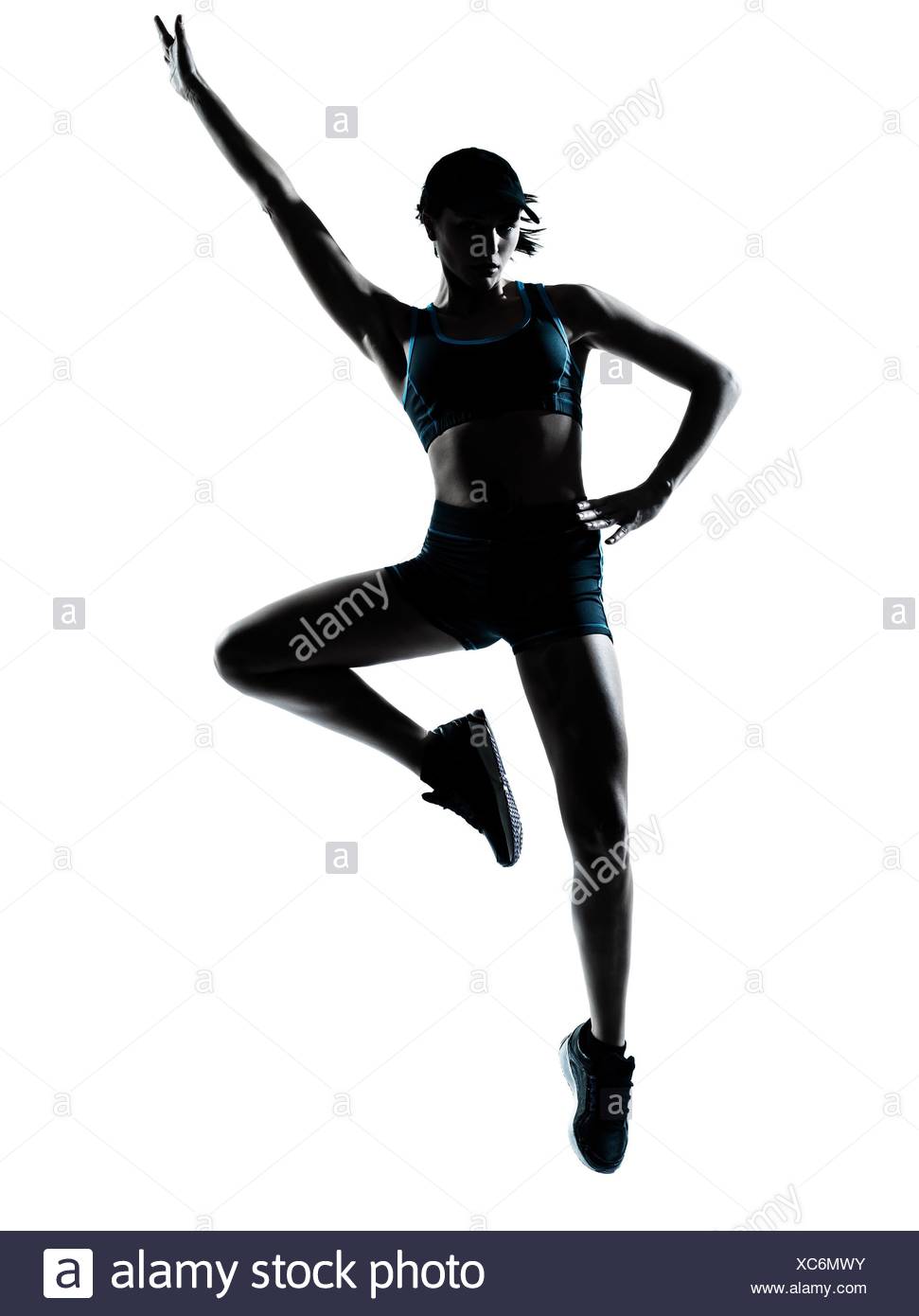 971x1390 Young Woman Jumping Studio Shot Stock Photos Amp Young Woman Jumping