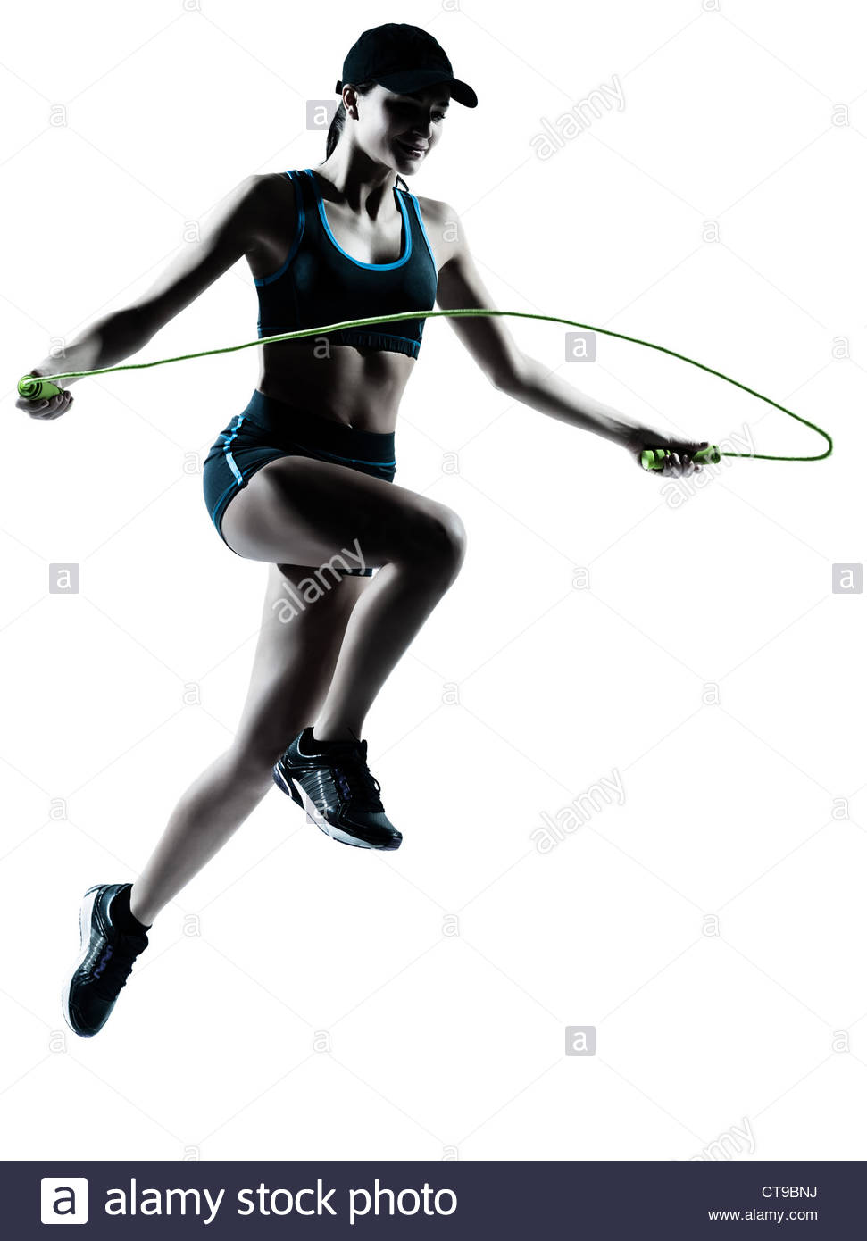 971x1390 One Caucasian Woman Runner Jogger Jumping Rope In Silhouette