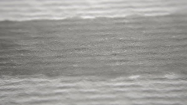 600x338 Black Ink Running Across Watercolor Paper. Shot In Macro And In