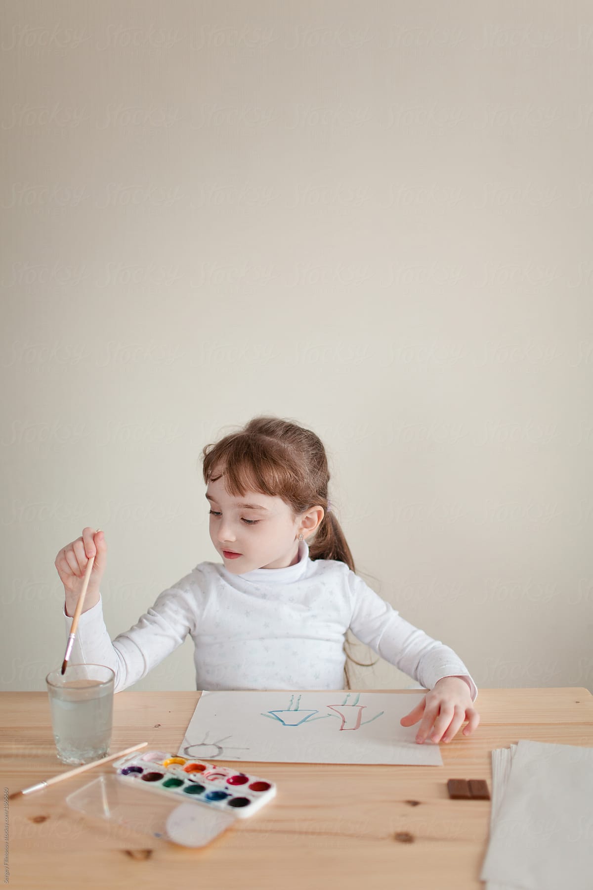 1200x1799 Little Girl Doing Painting With Watercolor Stocksy United