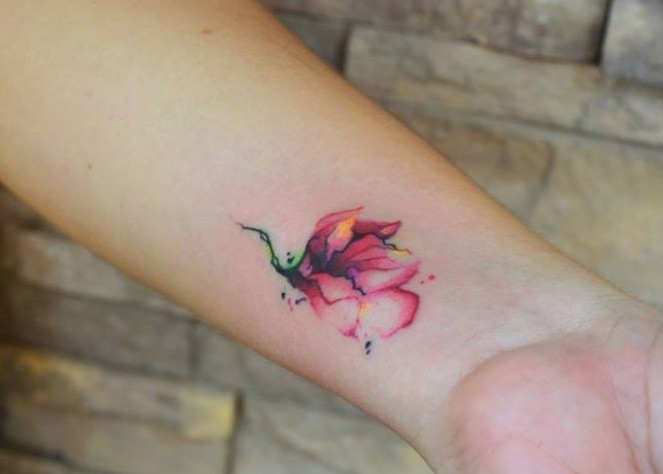 663x474 Impressive Colored Tiny Watercolor Flower Tattoo On Wrist