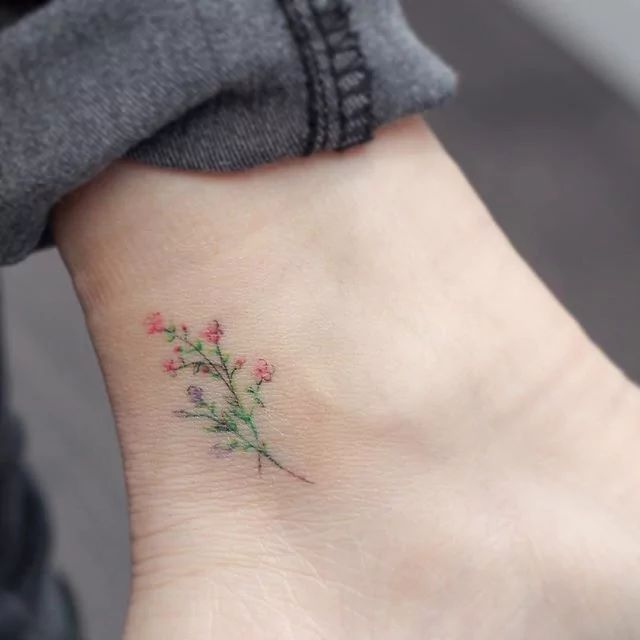 640x640 Tiny Watercolor Flower Tattoo On Ankle