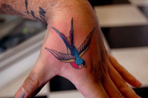 500x332 The Love And Loyalty Of Swallow Tattoos Tattoo Articles Ratta