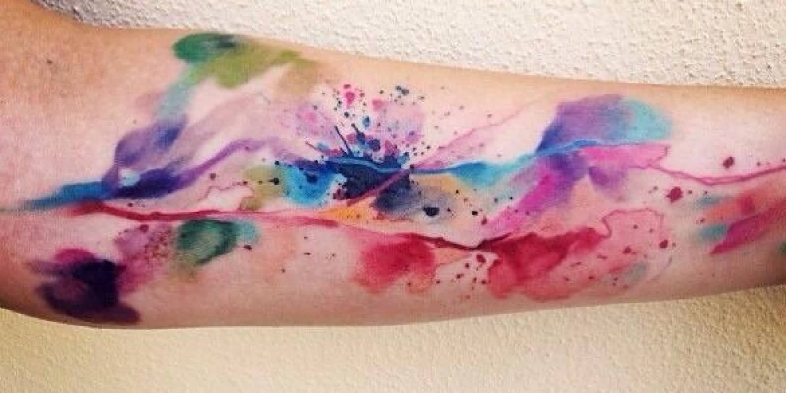 1600x800 Watercolor Splash Tattoo On Forearm