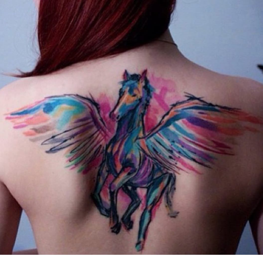 1055x1055 Colorful Watercolor Unicorn Tattoo On Girls Back