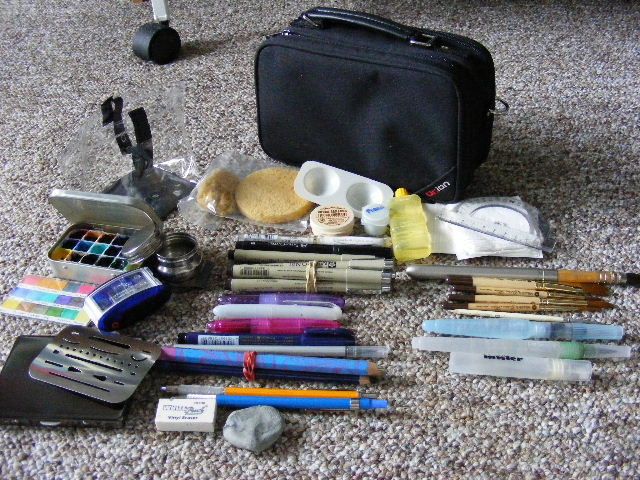 640x480 A Collapsible Clear Water Bucket Metal Tin Of Watercolors And